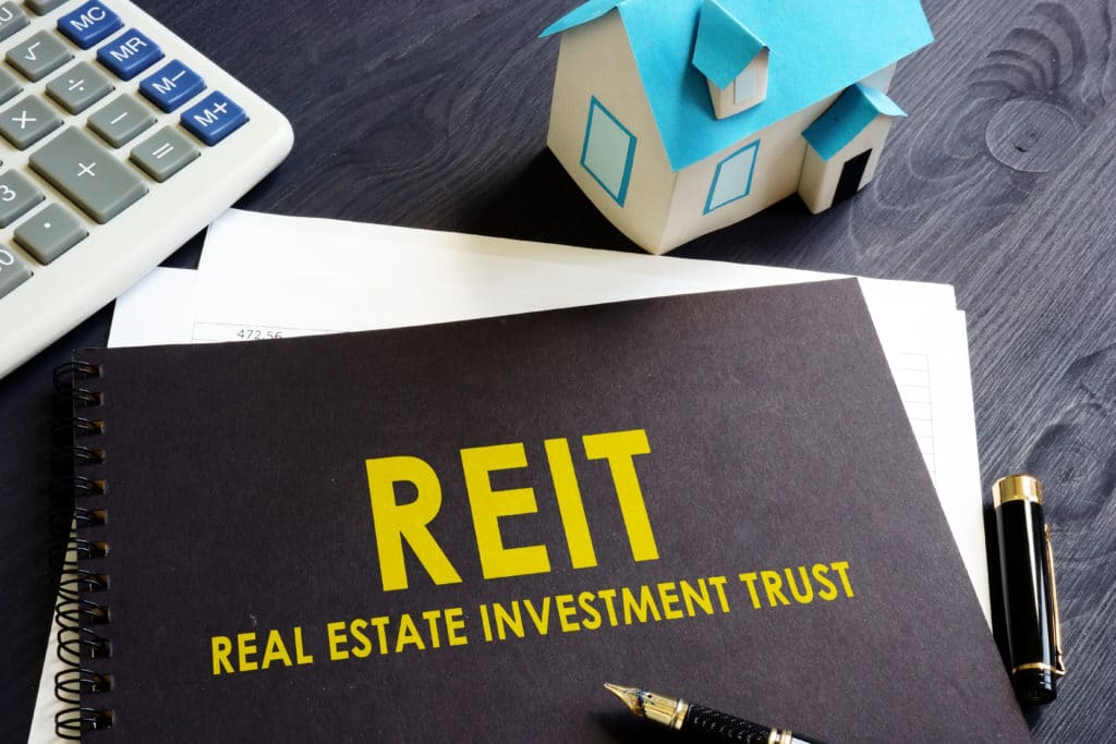 Real,estate,investment,trust,reit,on,an,office,desk.